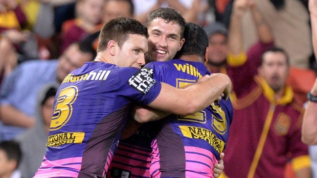 Blitz: Tevita Pangai Junior is congratulated after adding to the Broncos' try tally.