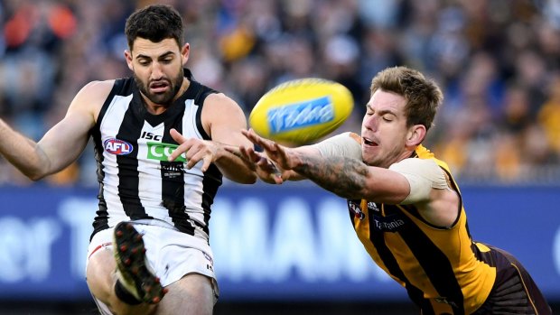 Spoiler: Hawthorn's Kaiden Brand attempts to smother a kick by Collingwood's Alex Fasolo during last season's round 15 clash at the MCG.