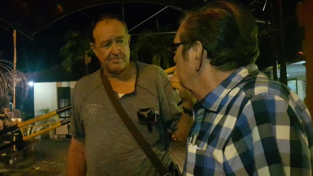 Garry Croker (left), a friend of the victim, outside South Denpasar police station after giving his statement.