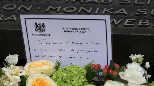 'We will never be cowed by terrorism': a wreath laid by British Prime Minister David Cameron on the memorial in Hyde Park.