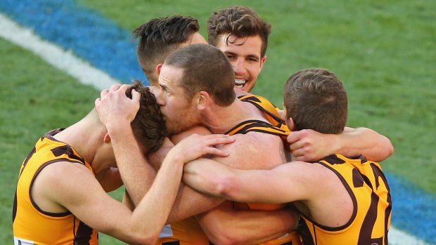 Roughead kisses the head of Taylor Duryea after kicking a goal during the 2014 AFL Grand Final 