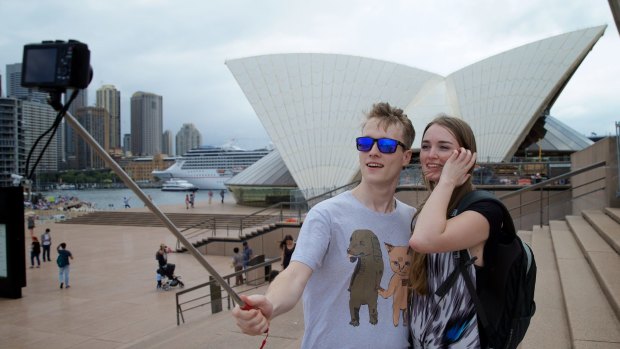 Great trick:  Alex Kyling and Linda Keizer use a selfie stick at the Opera House.