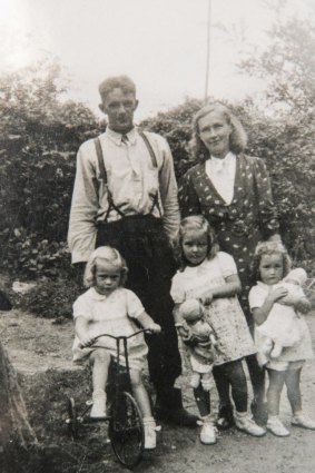 Coralie Richmond, front, centre, with her family who suffered much trauma after her father ended his own life.