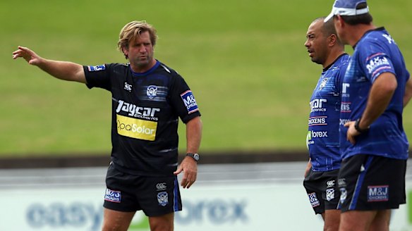 Feeling the strain: Coach Des Hasler instructs his team during a Canterbury Bulldogs training session at Belmore.