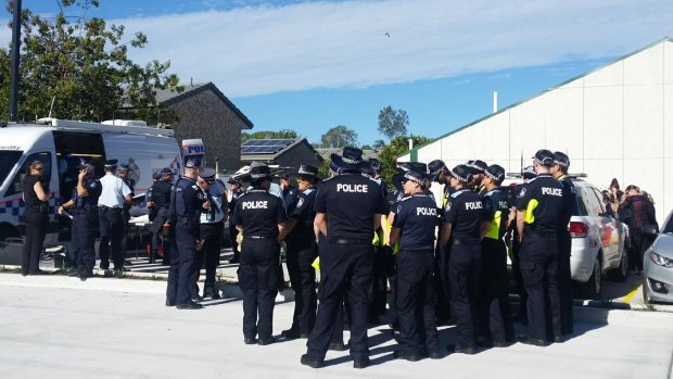 Off-duty officers from as far as Morningside, Brisbane gather to search for the missing girl.