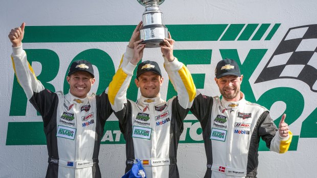 Ryan Briscoe (left), Antonio Garcia and Jan Magnussen celebrate winning last weekend's Daytona 24 hour GTLM class.