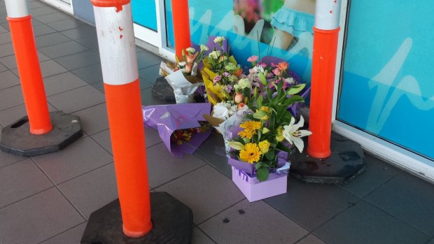 A makeshift tribute for a man who died after an altercation at Logan Central Plaza.