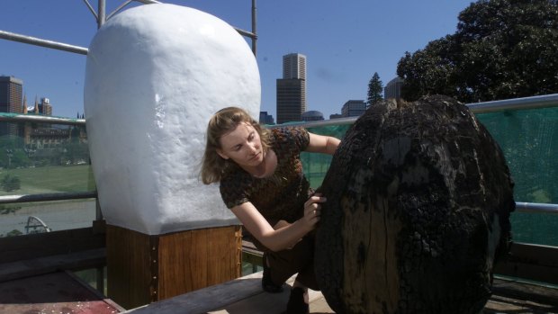 Cummins repairs damage to the Brett Whitely matchstick sculpture outside the Art Gallery of NSW in 2002.