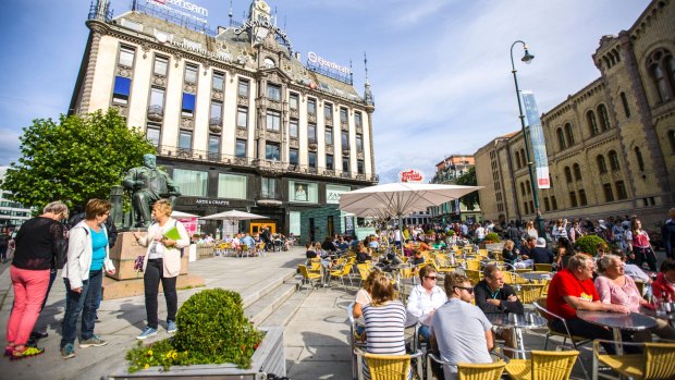 People relaxing in Oslo's city centre.