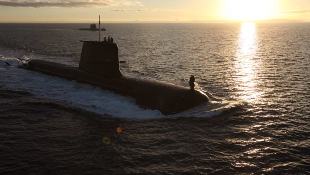 Australian Navy submarines, the  HMAS Dechaineux and HMAS Waller, on exercise.
