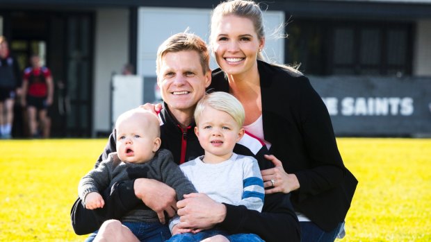 Nick Riewoldt at the announcement of his retirement, with his wife Catherine and his sons Will and James.