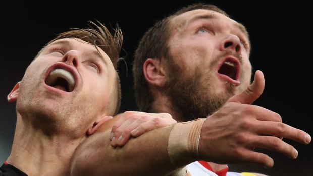 Shaun McKernan competes for the ball against Max Gawn in the ruck.