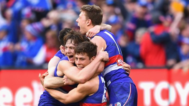 Top Dogs: Jackson Macrae, Josh Dunkley, Liam Picken and Toby McLean celebrate after the siren.