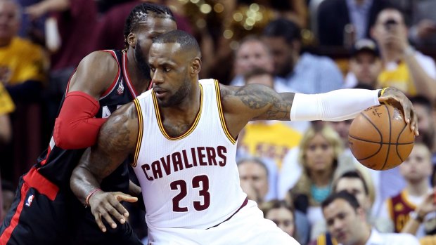 Dominant: LeBron James handles the ball against DeMarre Carroll.