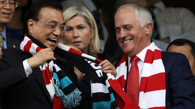 Chinese Premier Li Keqiang and Prime Minister Malcolm Turnbull share a joke at the Sydney Cricket Ground.