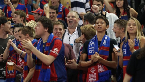 In full cry: Newcastle Jets owner Nathan Tinkler stood with the fans during last Friday's 4-3 defeat to Sydney FC.