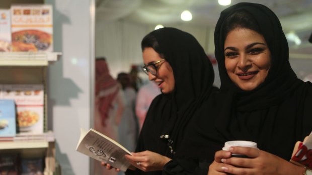 Saudi women visit the Jeddah International Book Fair on the day after the historic vote.