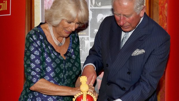 Cutting the cake: Prince Charles and Camilla Duchess of Cornwall at a reception to mark the 500th Anniversary of the Royal Mail in London, in 2016.