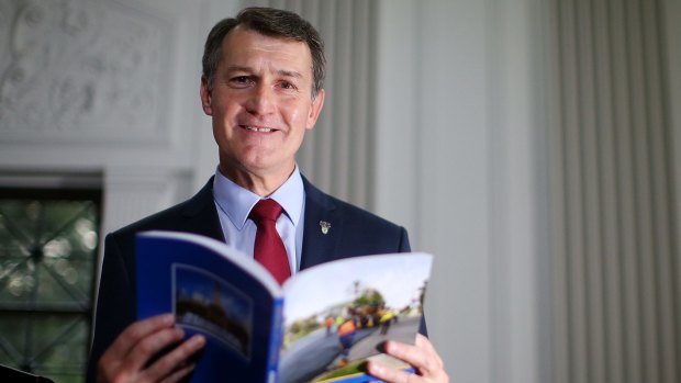 Lord Mayor Graham Quirk looks through the Brisbane City Council annual budget.