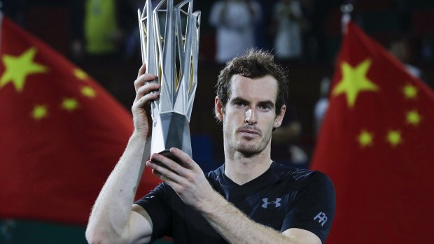 Andy Murray with trophy after winning his men's singles final match against Roberto Bautista Agut.