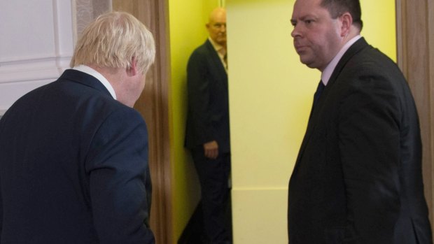 Leaving by emergency exit: Former London Mayor Boris Johnson leaves the press conference after he announced that he will not run for leadership of the Tories.