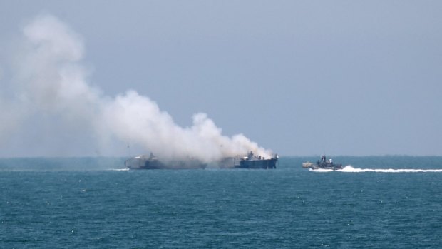 Smokes rises from the Egyptian Navy vessel on the coast of northern Sinai.