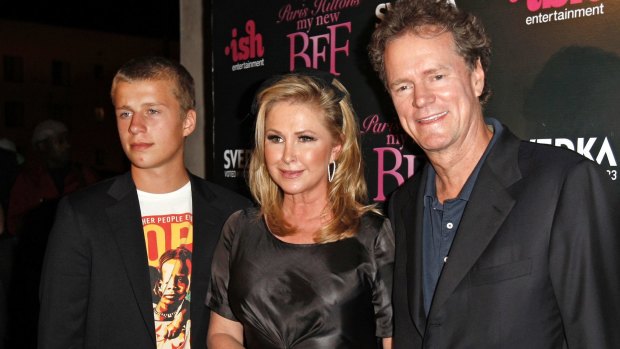 Conrad Hilton, left, seen here in 2008 with his mother Kathy Hilton and his father Rick Hilton, has been arrested in Los Angeles for allegedly stealing a car and violating an ex-girlfriend's restraining order. 