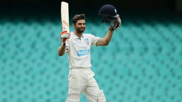 Ryan Carters celebrates his century during the Sheffield Shield match between New South Wales and Queensland at the SCG. 