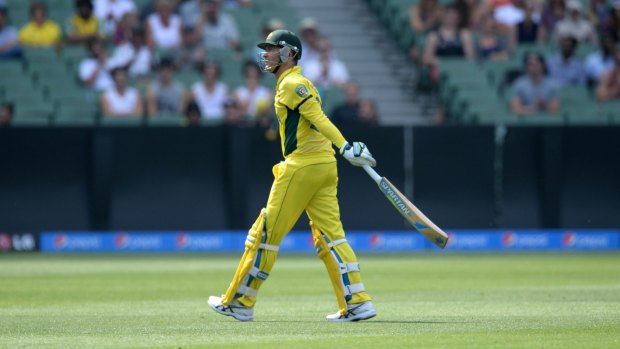 On the way out: Australia's Michael Clarke walks off the ground after being dismissed against the United Arab Emirates on Wednesday.