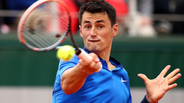 Tomic in action at the French Open.