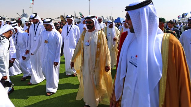 UAE prime minister and ruler of Dubai Sheikh Mohammed bin Rashid al-Maktoum, centre, tours the 14th Dubai Air Show in November 2015.