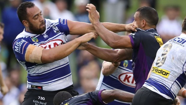 Stink: Sam Kasiano and Will Chambers grapple at Belmore Sports Ground.