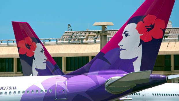 Island girl Pualani features on the tails of which airline's planes?