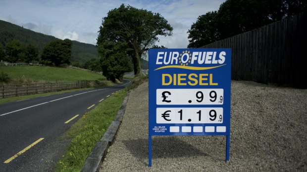 A petrol station sign with prices in euros and pounds sterling near the border between the Republic of Ireland and Northern Ireland in Omeath.