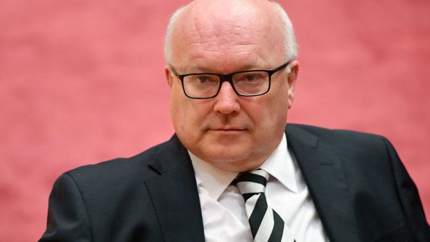 MPs who can "honestly swear" they didn't know they were dual citizens should be ruled eligible, George Brandis told the High Court.