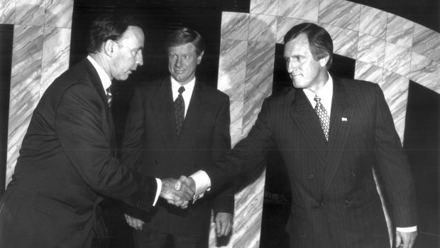 Prime Minister Paul Keating and Opposition Leader John Hewson shake hands before debating, with the ABC's Kerry O'Brien as moderator, during the 1993 election campaign. 
