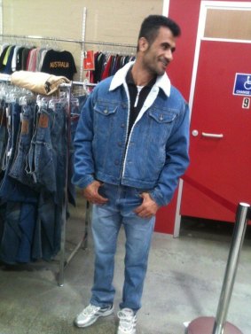 An Iranian Kurd had been found dead at Christmas Island. Fazel Chegeni trying on clothes at Savers in Melbourne.