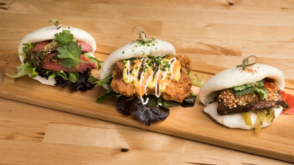 A trio of bao filled with pork belly, fried chicken and Taiwanese sausage.