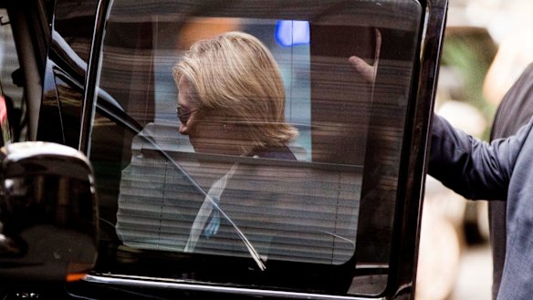 Democratic presidential candidate Hillary Clinton gets into a van as she leaves her daughter's apartment.