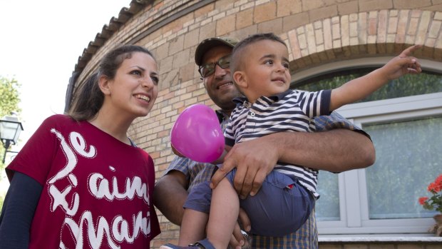 Syrian refugee Nour Essa, her husband Hasan Zaheda and their two-year-old son Riad at the St Egidio charity's base in Rome. Nour and her family were brought to Italy from Lesbos by Pope Francis. 