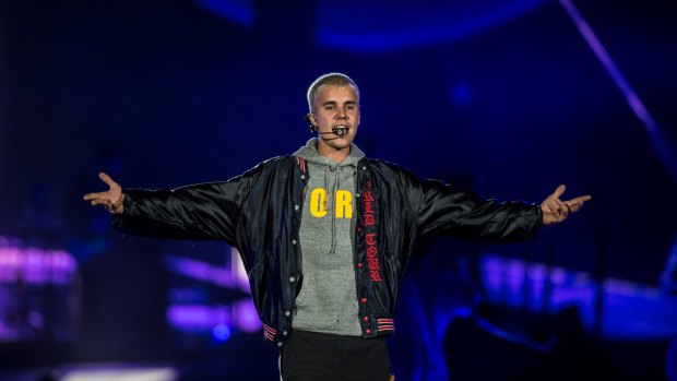 A university lecturer is accused of posing as pop star Justin Bieber online.