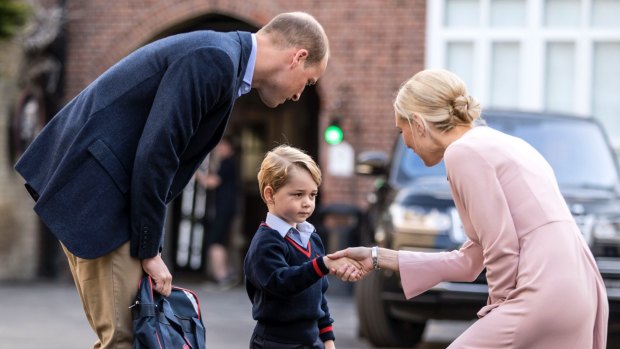 Prince George shakes the hand of Helen Haslem, head of the lower school last week.
