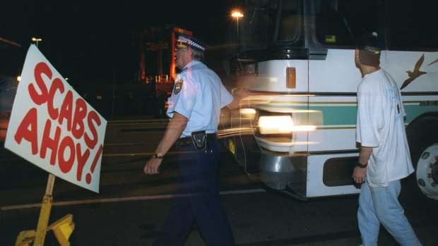 Police escorting non-union labour to Patrick Stevedores through the MUA picket lines in 1998. Today, strike action is low.