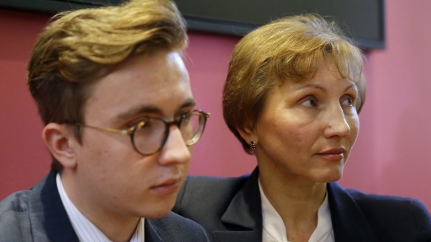 Marina Litvinenko, widow of former Russian spy Alexander Litvinenko, places her arm around son Anatoly during a press conference in London.