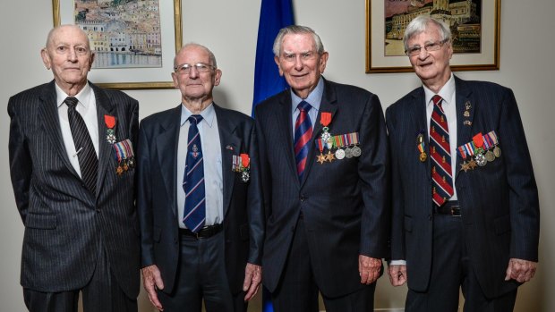 Australian WWII veterans Ronald Cleaver, Donald McDonald, James Coulter and Denis Kelly receive the Legion d'Honneur from France for their service.