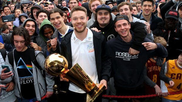 Matthew Dellavedova with the NBA trophy he won as a member of the Cleveland Cavaliers.