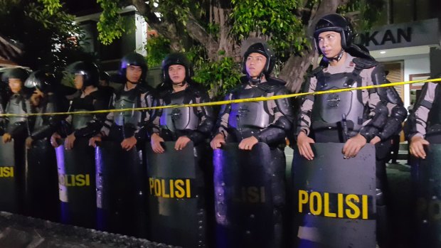 Riot police gather outside Kerobokan prison for the transfer.