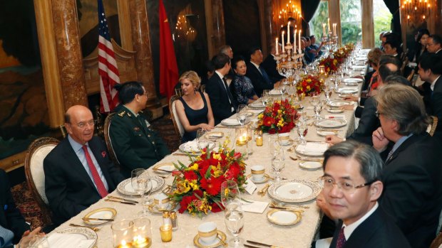 President Donald Trump and Chinese President Xi Jinping, with their wives seated at the centre, during a dinner at Mar-a-Lago.