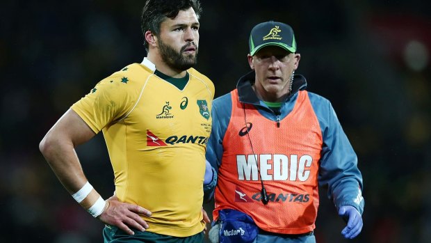 Adam Ashley-Cooper is led from the field suffering from concussion in a match against the All Blacks in August.