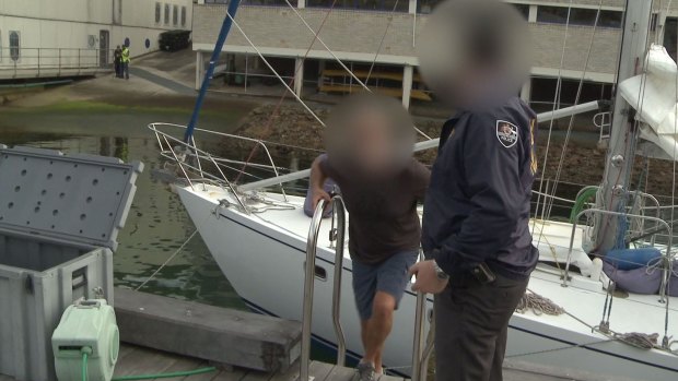 Hamish Thompson is arrested by police after they allegedly seized 1.4 tonnes of cocaine from the yacht Elakha.